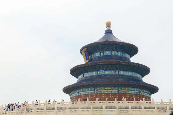 View of the Temple of Heaven in Beijing with the Hall of Prayer for Good Harvests and visitors in the background.