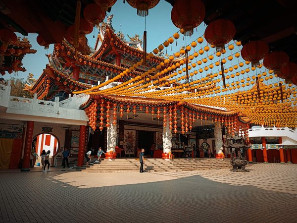 Thean Hou Temple in Kuala Lumpur with red and yellow lanterns and traditional Chinese architectural details.