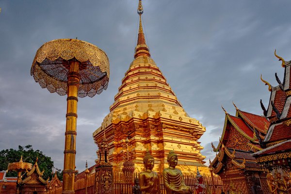 Golden Wat Phra That Doi Suthep temple at sunset, iconic landmark of Doi Suthep-Pui National Park in Chiang Mai.