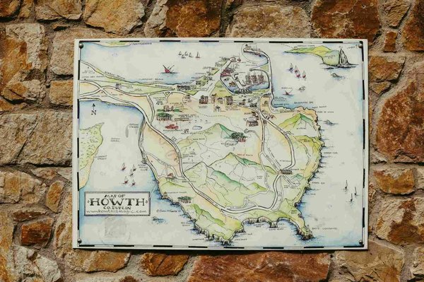 Illustrated map of Howth, a location near Dublin, on a stone wall.