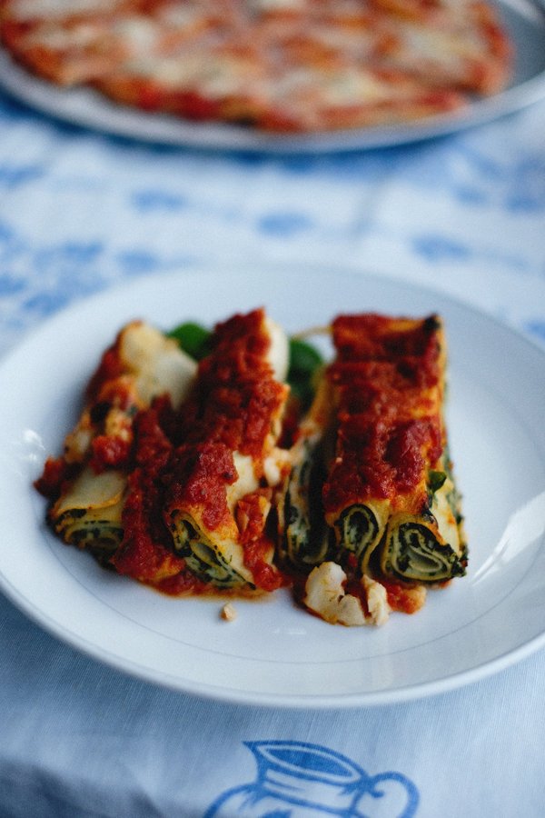 Rolled cannelloni tubes filled with spinach and ricotta, topped with tomato sauce, cannelloni alla sorrentina at O'Parrucchiano La Favorita.
