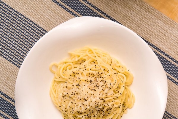 Cacio e pepe pasta coated in pecorino cheese and black pepper.