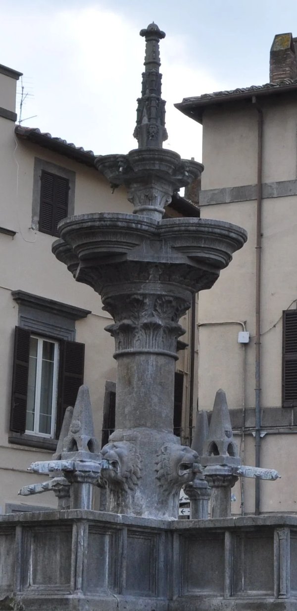 Fontana Grande in Viterbo, detail of the historic fountain with lion heads and stone decorations.