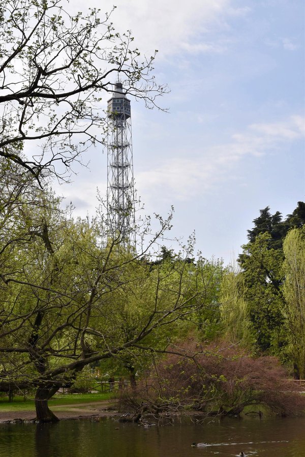 Torre Branca observation tower rising above the trees of Parco Sempione in Milan.
