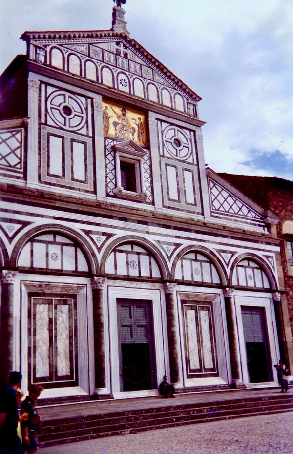 Facade of the Basilica di San Miniato al Monte in Florence, with its geometric marble inlay and mosaic.