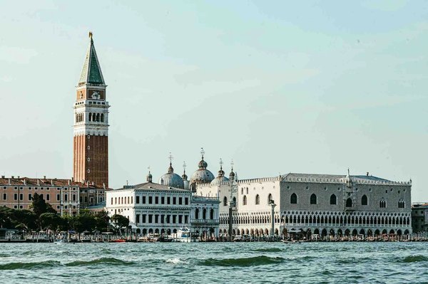 Doge's Palace and St. Mark's Campanile in Venice seen from the Grand Canal.