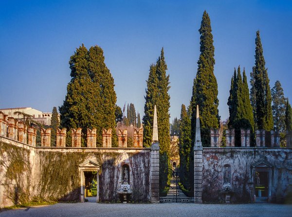 The cypress-lined avenue and obelisks at the entrance of Giardino Giusti in Verona.