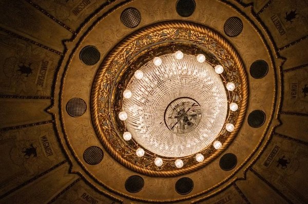 View of the chandelier and decorated ceiling of Teatro Solís in Montevideo, Uruguay.